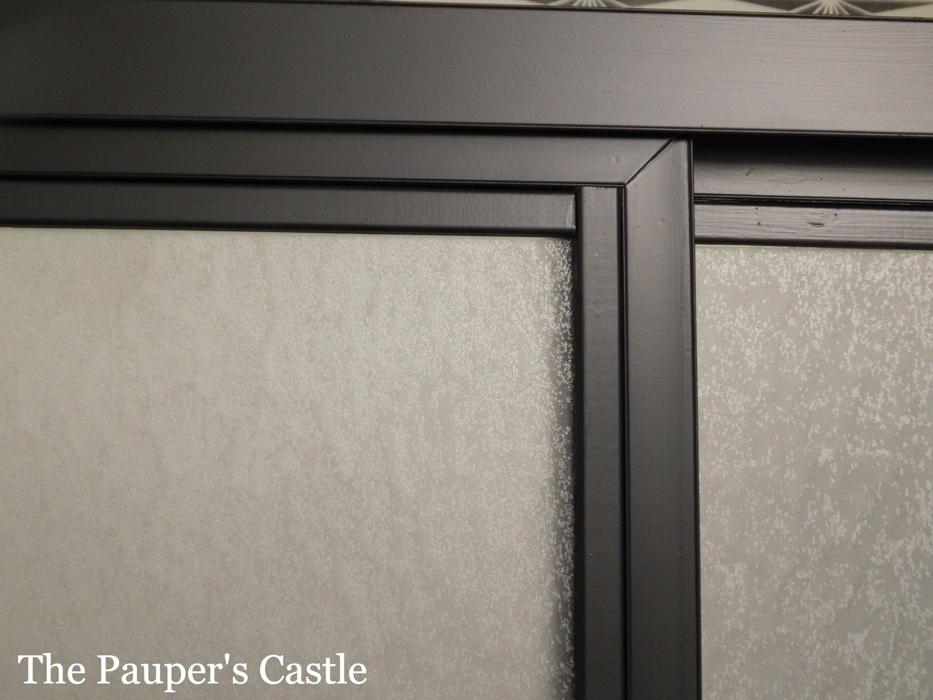 Don't replace, Restyle your old shower doors with paint and trim. The Pauper's Castle