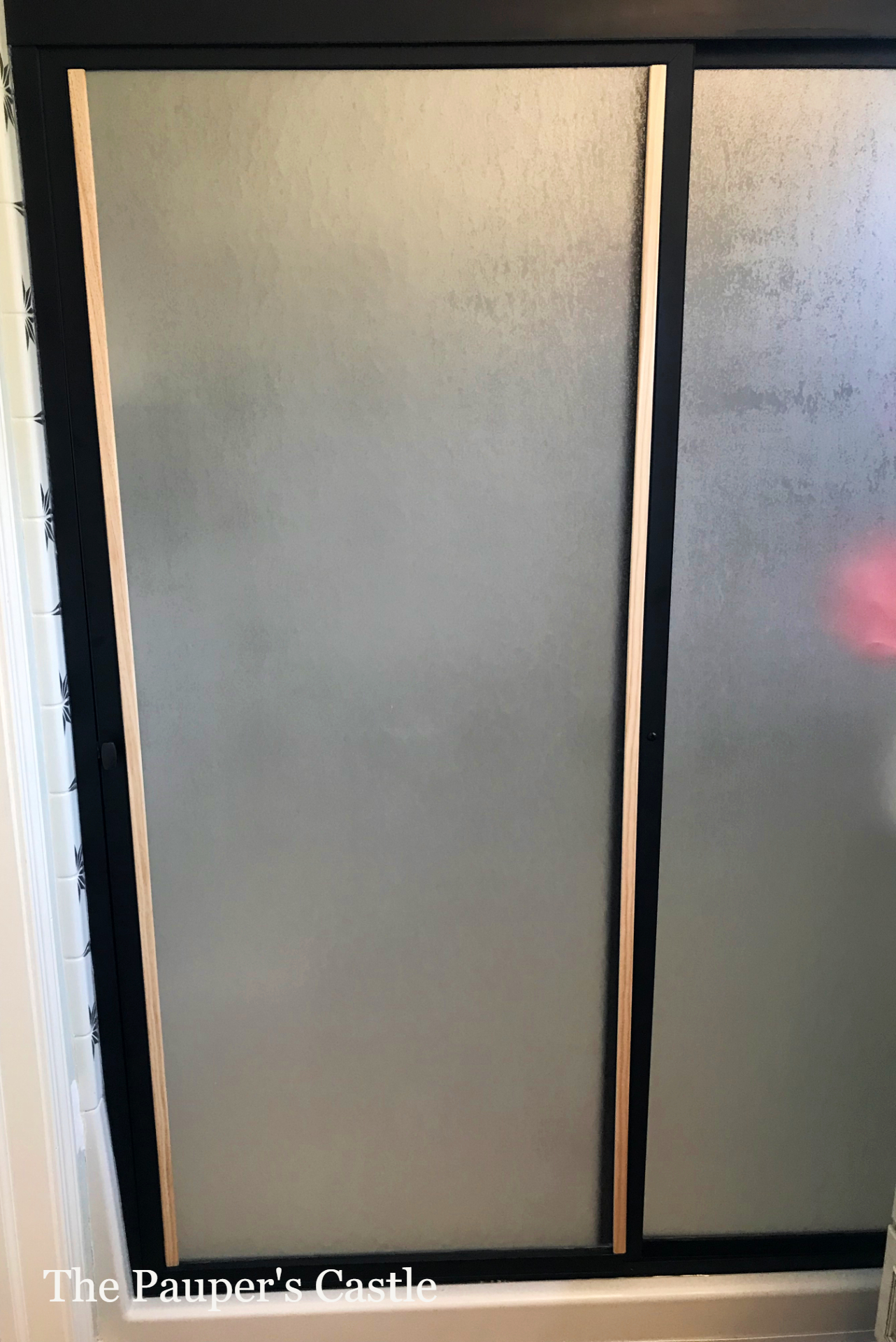 Don't replace, Restyle your old shower doors with paint and trim. The Pauper's Castle